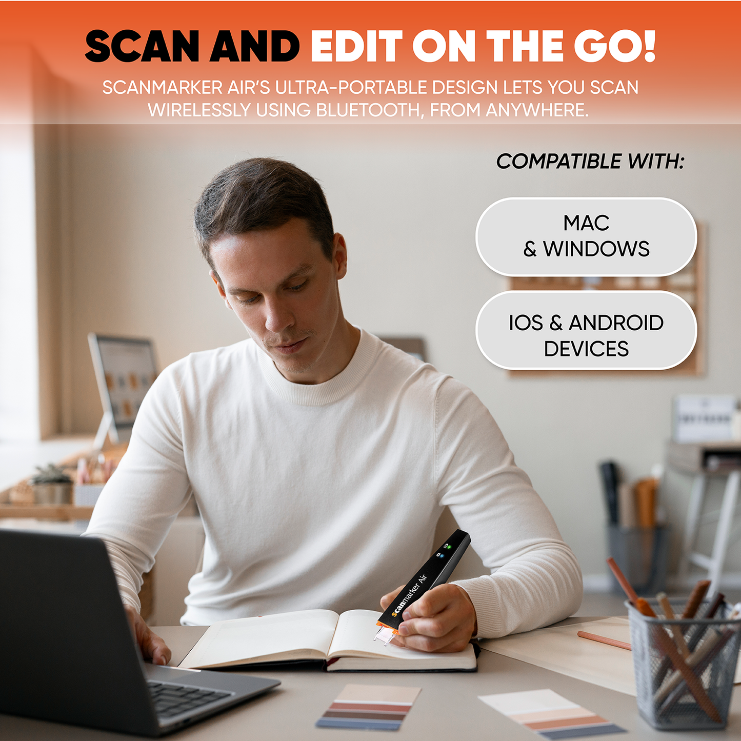an adult scanning a book using scanmarker air and a computer . Notation that is compatible with mac windows , ios and android devices