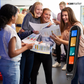 a group of students happy holding exams results and the image of exam pen